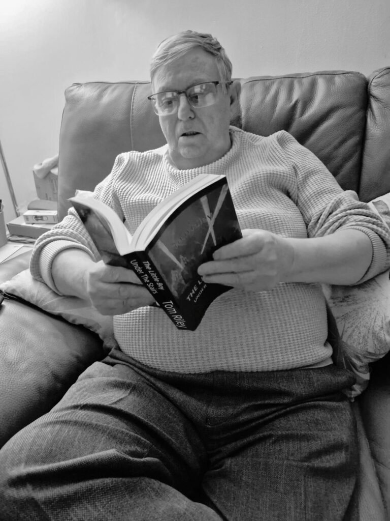img-20260319-wa00038082429303670978994.jpg picture of man reading book