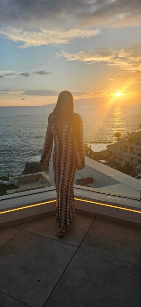 Image of lady standing in sunset