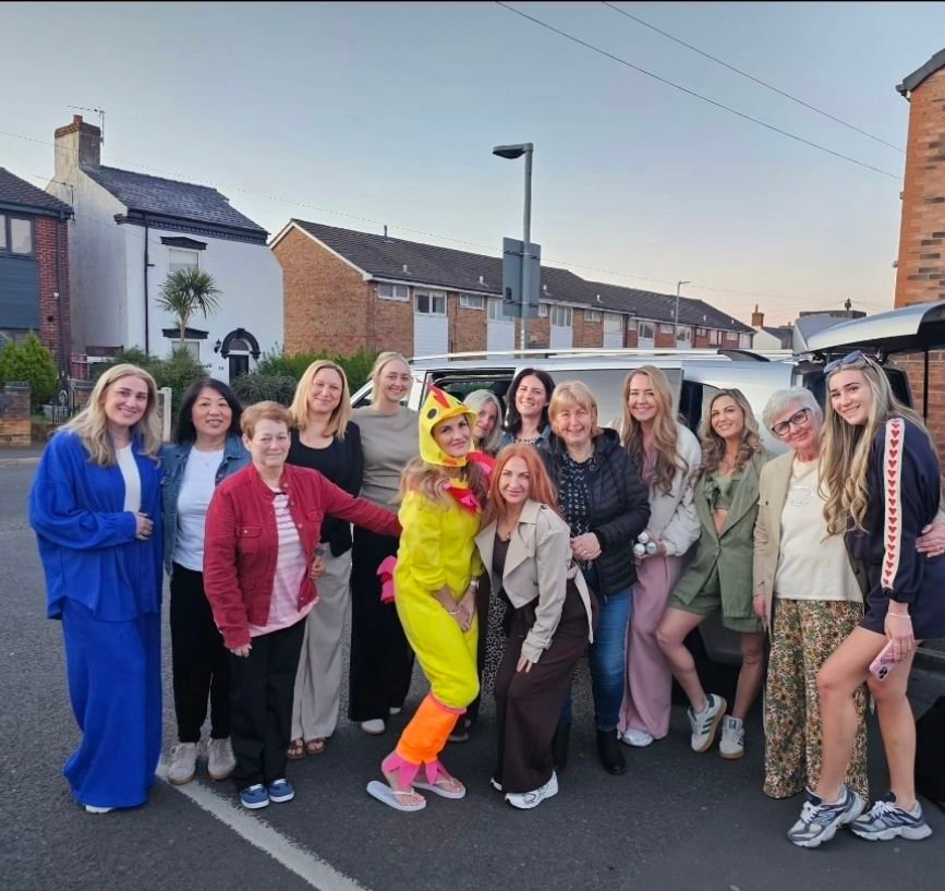 image of group of women standing in street