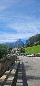 Village buildings and green hills beneath the mountains near Johnsbach, Austria