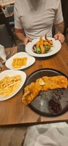 Schnitzel, chips and vegetables served at a restaurant in Austria